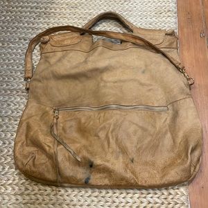 Super cool leather bag.  Good condition aside from some pen marks. 24” H x 18” W